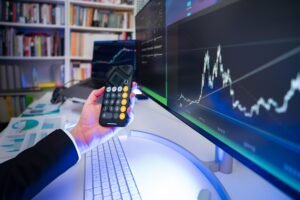 A modern office desk setup with financial analysis tools, highlighting technology in business strategy.