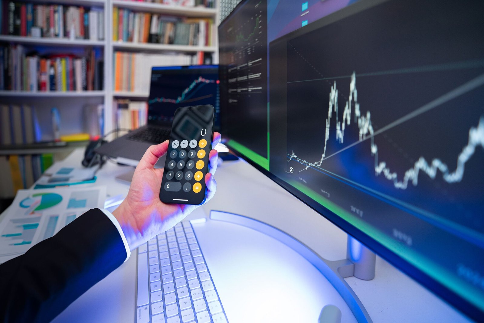 How to Invest in ETFs for Beginners: 7 Smart Steps to Build Long-Term Wealth 2 A modern office desk setup with financial analysis tools, highlighting technology in business strategy.
